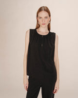 Top sans manches noir Texto