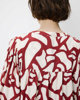Blouse col V à imprimé géométrique terracotta Ambrine